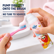 Pump strawberry foam toothpaste directly onto a child’s toothbrush without squeezing a tube