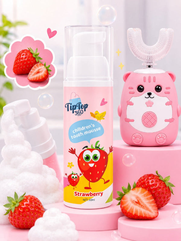 Strawberry kids foam toothpaste beside a pink U-shaped toothbrush