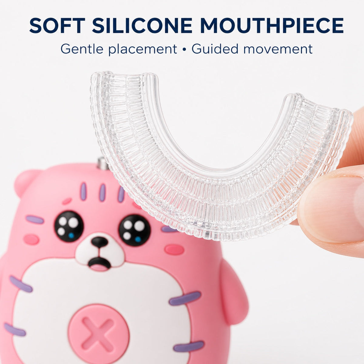 Close-up of the soft silicone mouthpiece for the pink kids U-shaped toothbrush